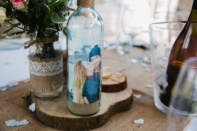 Table Centre Wood Slice Tree Hessian Lace Bottle Personalised Relaxed Fun Beach DIY Wedding http://www.michellehuggleston.com/