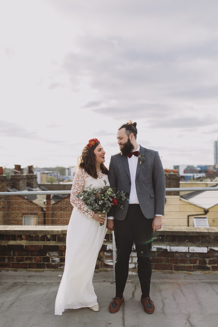 Bride Bridal Dress Gown Lace Long Sleeve Sweetheart Bouquet Red Burgundy Rose Greenery Eucalyptus Flower Crown Tweed Grey Groom Mismatched Bow Tie Alternative London Warehouse Wedding https://www.lukehayden.co.uk/