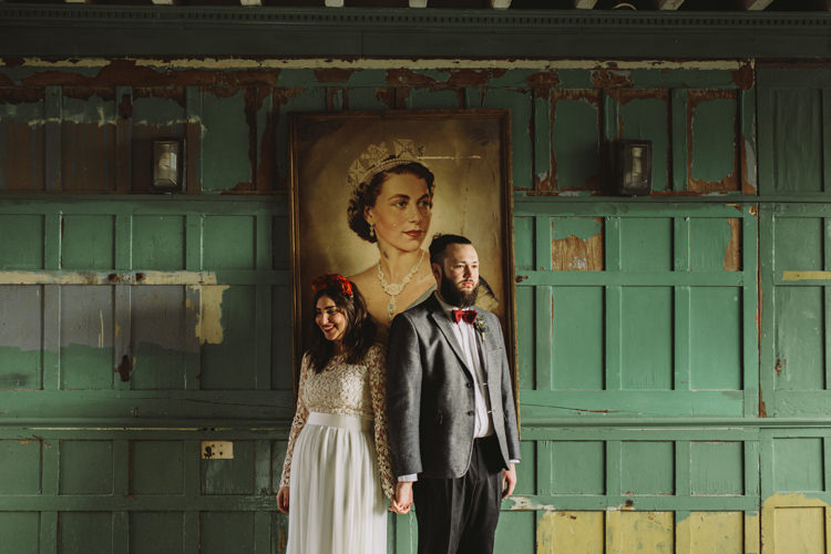 Bride Bridal Dress Gown Lace Long Sleeve Sweetheart Red Burgundy Rose Flower Crown Grey Tweed Groom Bow Tie One Friendly Place Alternative London Warehouse Wedding https://www.lukehayden.co.uk/