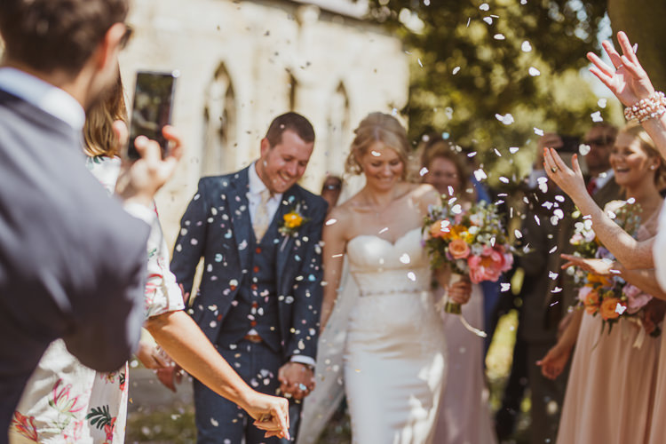 Bride Bridal Sweetheart Neckline Gown Dress Tweed Three Piece Waistcoat Groom Navy Multicolour Colourful Bouquet Confetti Rural Clifftop Tipi Wedding https://www.njphotographic.co.uk/