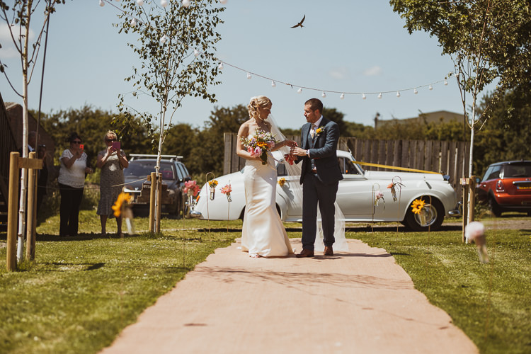 Bride Bridal Sweetheart Neckline Gown Dress Tweed Three Piece Waistcoat Groom Navy Multicolour Colourful Bouquet Festoon Lighting Rural Clifftop Tipi Wedding https://www.njphotographic.co.uk/