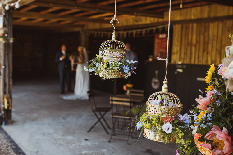 Gold Sprayed Birdcage Floral Flower Hanging Multicolour Colourful Rural Clifftop Tipi Wedding https://www.njphotographic.co.uk/