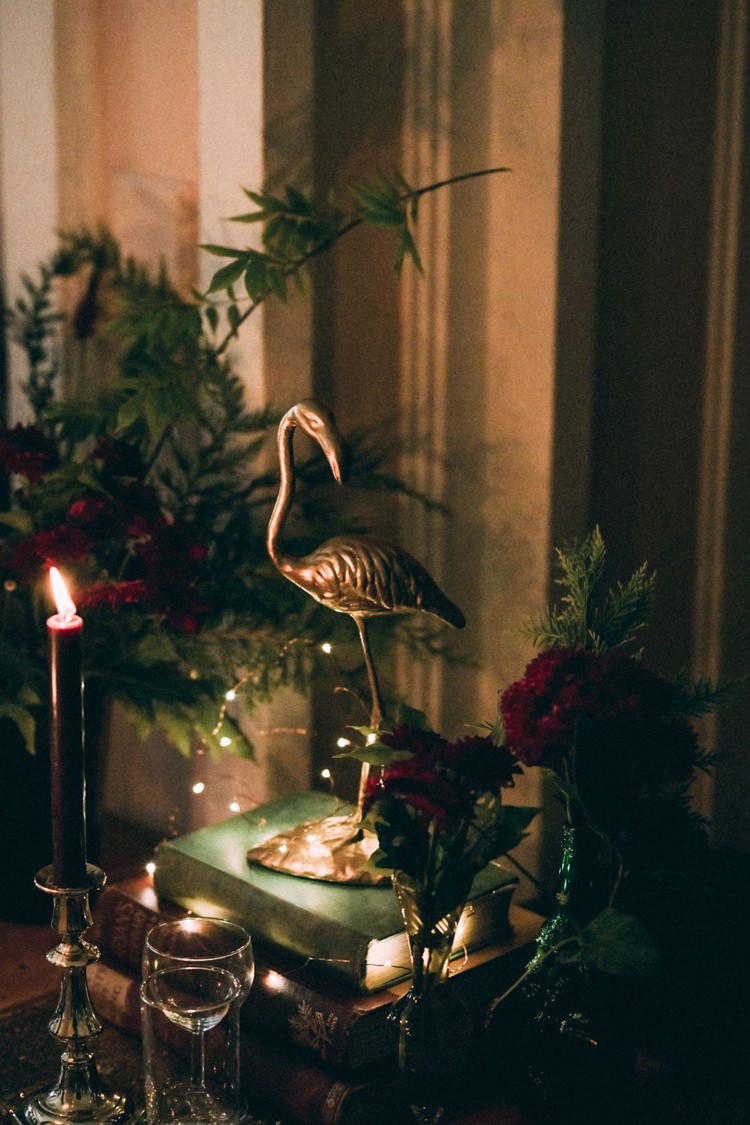 Black Candles Candlesticks Gold Animals Spray Painted Books Vintage Antique Table Setting Fairy Lights Opulent Eccentric Berry Gold Wedding https://mattaustinimages.co.uk/