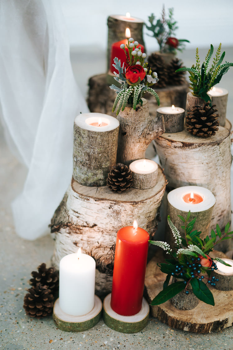 Tree Stump Log Decor Candles Flowers Pine Cones Red Green Winter Wonderland Wedding Ideas http://www.angelawardbrown.com/