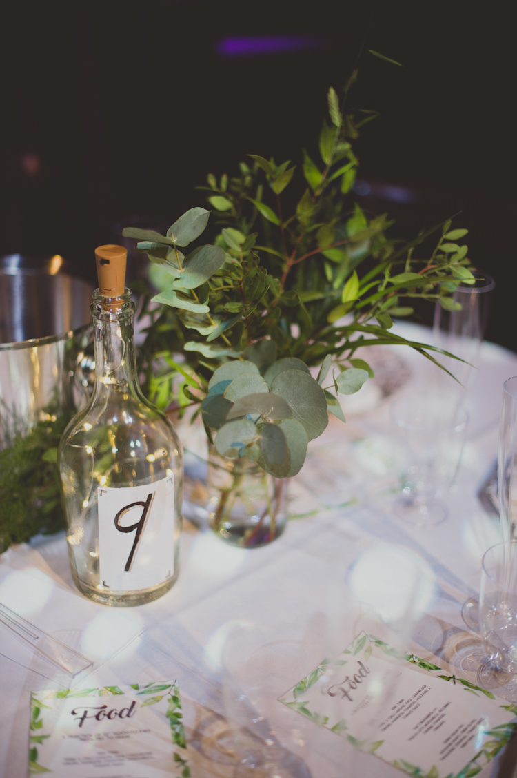 Centrepiece Flowers Greenery Bottle Table Number Botanical Gold Sequin Music Hall Wedding http://sashaweddings.co.uk/