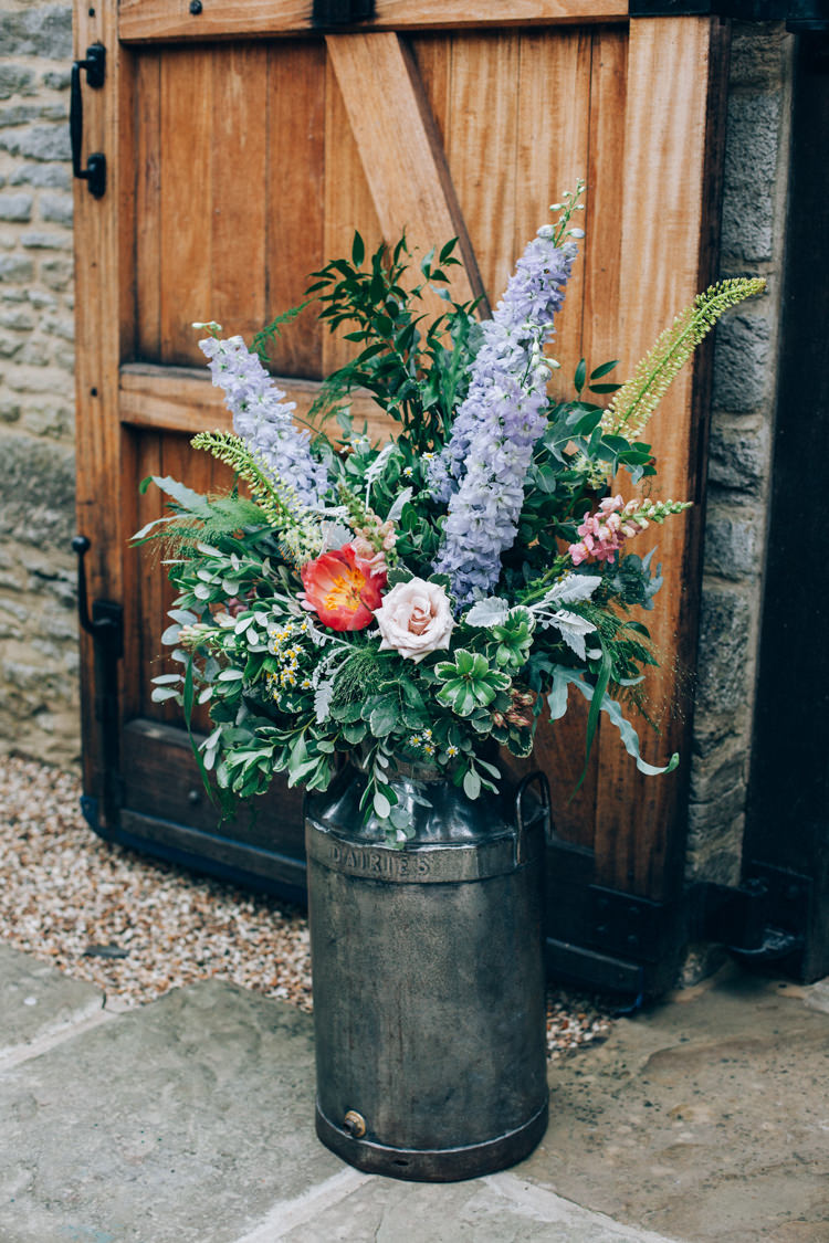 Milk Churn Flowers Pink Blue Greenery Ceremony Outdoor Flowery Bohemian Secret Garden Wedding https://caseyavenue.co.uk/