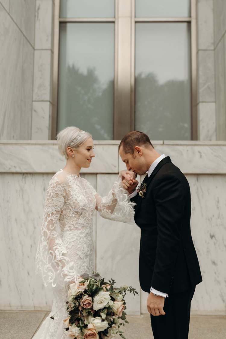 Modern Stylish Chic Bridalwear Wedding Dress Long Bell Sleeves Intricate Illusion Lace Short Hair Groom Kiss | Urban Industrial Luxe Wedding http://hellencophotos.com/