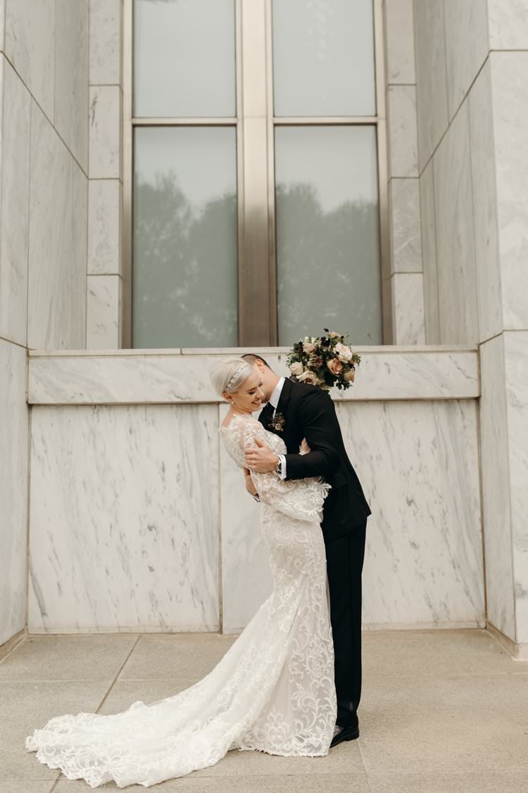 Modern Stylish Chic Bridalwear Wedding Dress Long Bell Sleeves Intricate Illusion Lace Short Hair Groom Kiss | Urban Industrial Luxe Wedding http://hellencophotos.com/