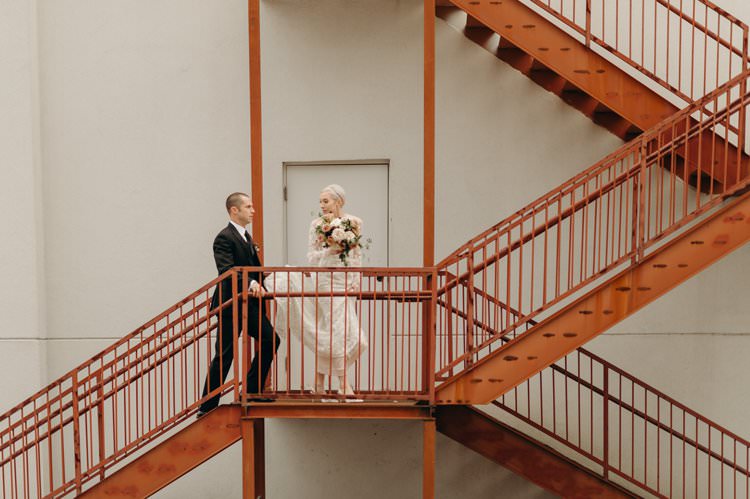 Modern City Bride Groom Staircase The Foundry Puritan Mill | Urban Industrial Luxe Wedding http://hellencophotos.com/