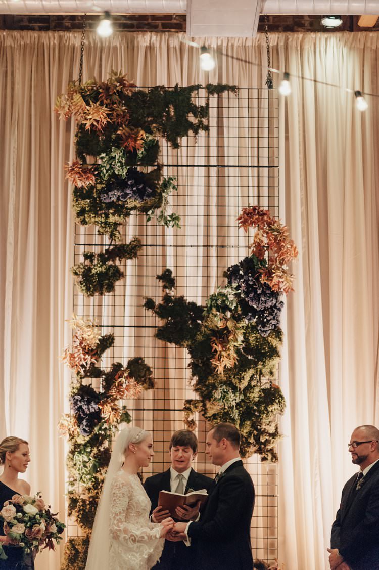 Modern Stylish Chic Geometric Ceremony Aisle Installation Backdrop Moss Candles Warehouse | Urban Industrial Luxe Wedding http://hellencophotos.com/