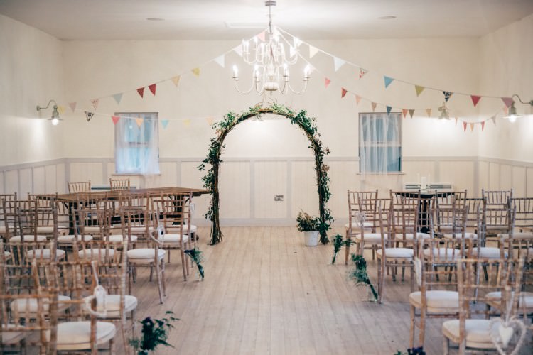 Vintage Bunting Foliage Floral Arch Ceremony Old Fashioned Fete Cricket Pavilion Wedding https://www.naomijanephotography.com/