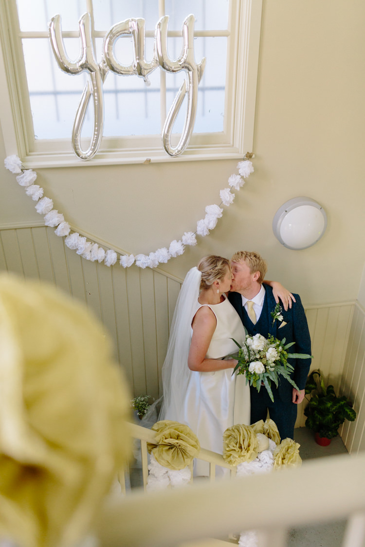 The Tab Centre Shoreditch Paper Pompom Garland Silver Yay Balloon London Urban Bride Groom Kiss | Modern Tropical Gold Urban Wedding https://www.christinewehrmeier.com/