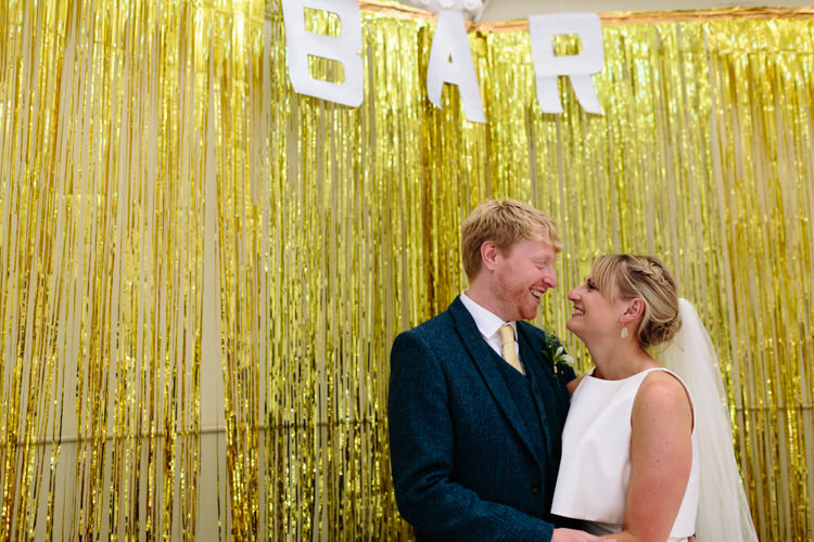 The Tab Centre London Shoreditch Couple Gold Glitter Curtain Bar Sign Fun Wedding | Modern Tropical Gold Urban Wedding https://www.christinewehrmeier.com/