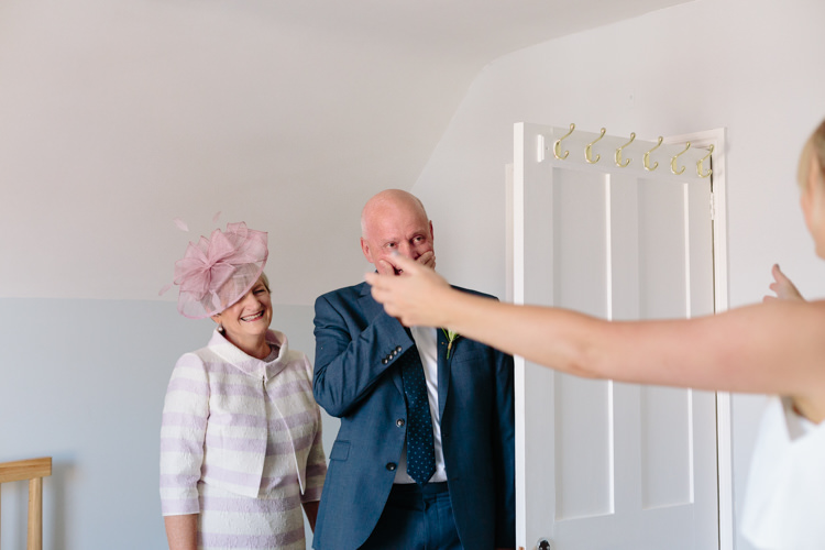 Bride Mother Father Embrace Hug First Look Emotional Happy | Modern Tropical Gold Urban Wedding https://www.christinewehrmeier.com/