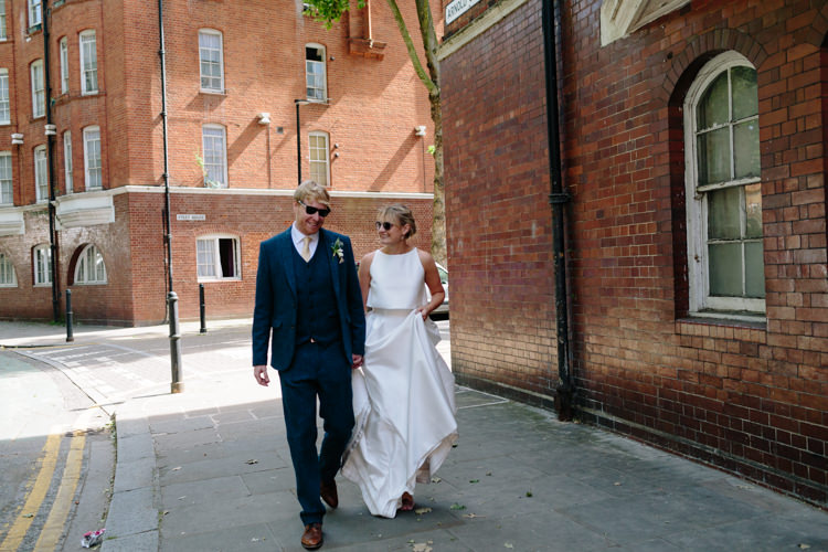Sunny London City Bride Groom Buildings Street Jesus Peiro Dress Navy Suit | Modern Tropical Gold Urban Wedding https://www.christinewehrmeier.com/