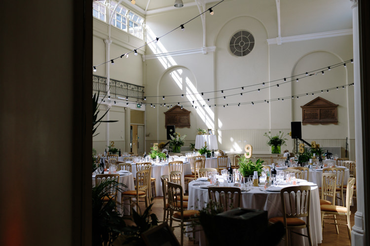 London Shoreditch The Tab Centre Wedding White Gold Green Tropical Festoon Lights Paper Pompoms | Modern Tropical Gold Urban Wedding https://www.christinewehrmeier.com/