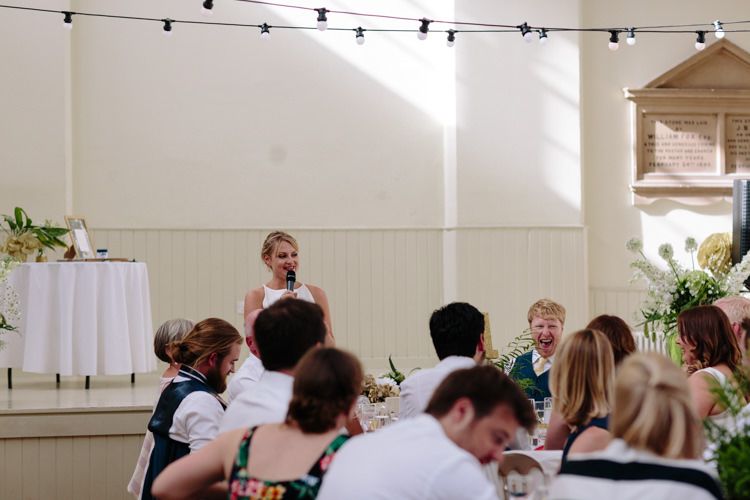 London Shoreditch The Tab Centre Wedding White Gold Green Tropical Festoon Lights Bride Speech | Modern Tropical Gold Urban Wedding https://www.christinewehrmeier.com/