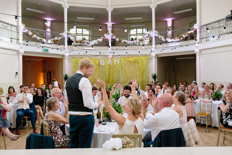 London Shoreditch The Tab Centre Wedding White Gold Green Tropical Festoon Lights Paper Pompoms | Modern Tropical Gold Urban Wedding https://www.christinewehrmeier.com/
