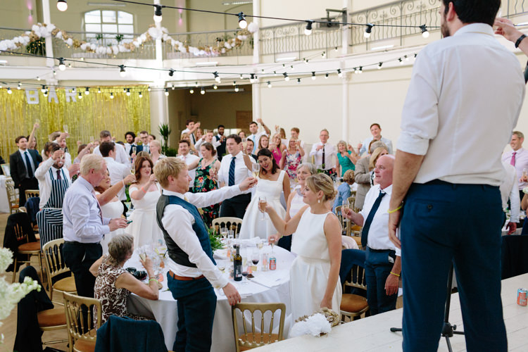 London Shoreditch The Tab Centre Wedding White Gold Green Tropical Festoon Lights Paper Pompoms | Modern Tropical Gold Urban Wedding https://www.christinewehrmeier.com/