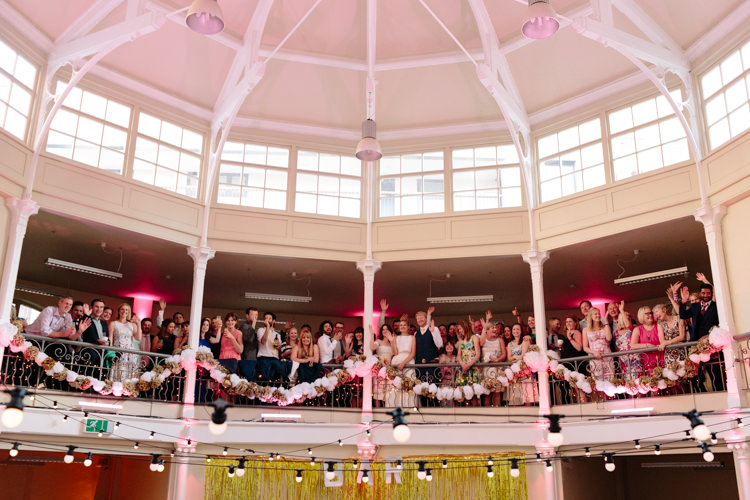 London Shoreditch The Tab Centre Wedding White Gold Green Tropical Festoon Lights Paper Pompoms | Modern Tropical Gold Urban Wedding https://www.christinewehrmeier.com/
