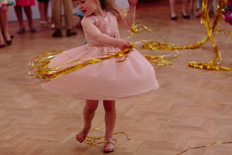 Dance Floor Gold Ribbon Curtain Dancing Girl Kids | Modern Tropical Gold Urban Wedding https://www.christinewehrmeier.com/
