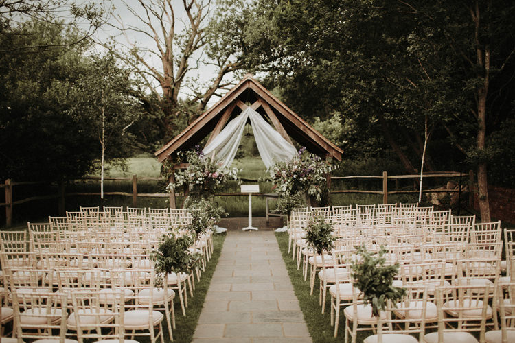 Outdoor Ceremony Flowers Arch Backdrop Silvery Grey Nature Wedding https://jonathanellisblog.com/