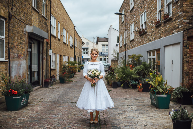 Bride Bridal Candy Anthony Polka Dot Peter Pan Collar Tea Length Bouquet Chic Relaxed London Pub Wedding https://theshannons.photography/