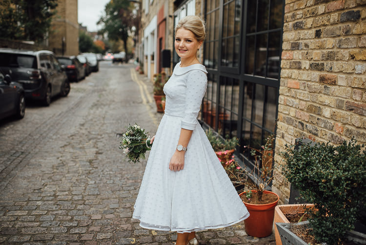 Bride Bridal Candy Anthony Polka Dot Peter Pan Collar Tea Length Dress Gown BouquetChic Relaxed London Pub Wedding https://theshannons.photography/