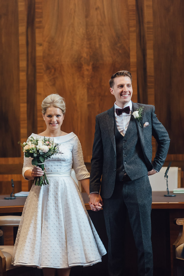 Bride Bridal Candy Anthony Polka Dot Peter Pan Collar Tea Length Groom Three Piece Suit Waistcoat Grey Tweed Burgundy Bow Tie Pocket Square Bouquet Chic Relaxed London Pub Wedding https://theshannons.photography/