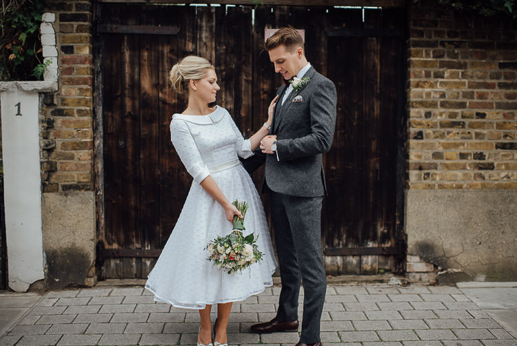 Bride Bridal Candy Anthony Polka Dot Peter Pan Collar Tea Length Groom Three Piece Suit Waistcoat Grey Tweed Burgundy Bow Tie Pocket Square Bouquet Chic Relaxed London Pub Wedding https://theshannons.photography/