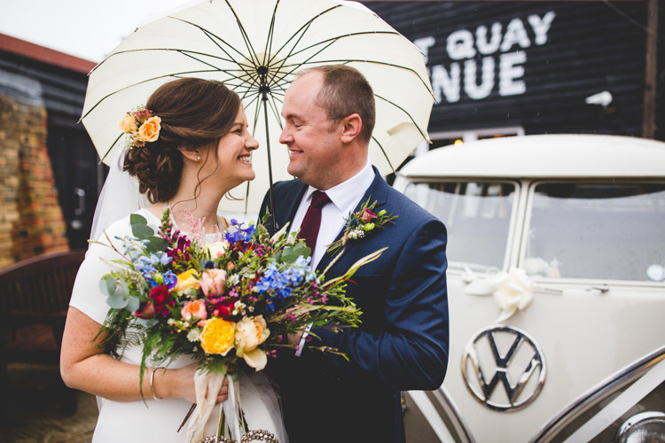 Groom Navy Suit Bride Bridal Floor Length T Shirt Neckline Short Sleeves Multicolour Wild Flower Bouquet Umbrella Colourful Fun Cosy Rainy Sea Wedding http://www.livvy-hukins.co.uk/