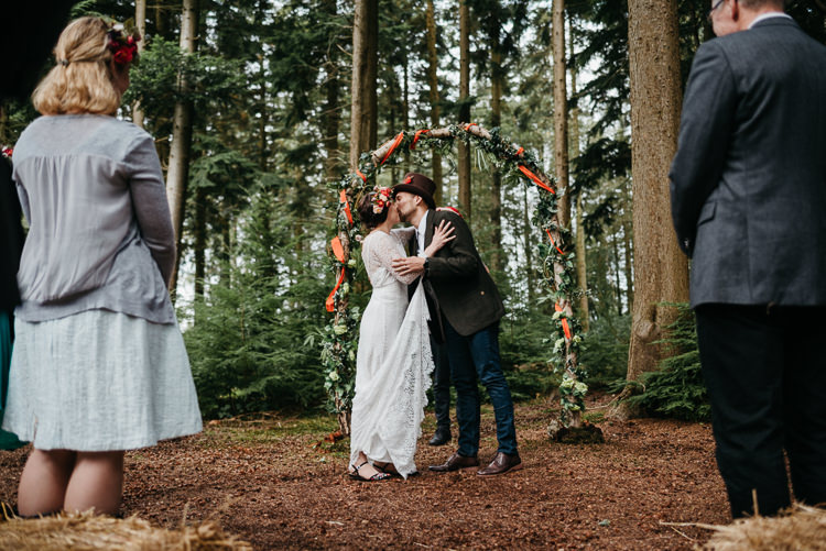 Bride Bridal Vintage Lace Dress Long Sleeved Flower Crown Bouquet White Stuff Groom No Tie Waistcoat Three Piece Suit Top Hat Tweed Floral Foliage Arch Ribbon Ceremony Folky Woodland Adventure Wedding https://elainewilliamsphoto.com/
