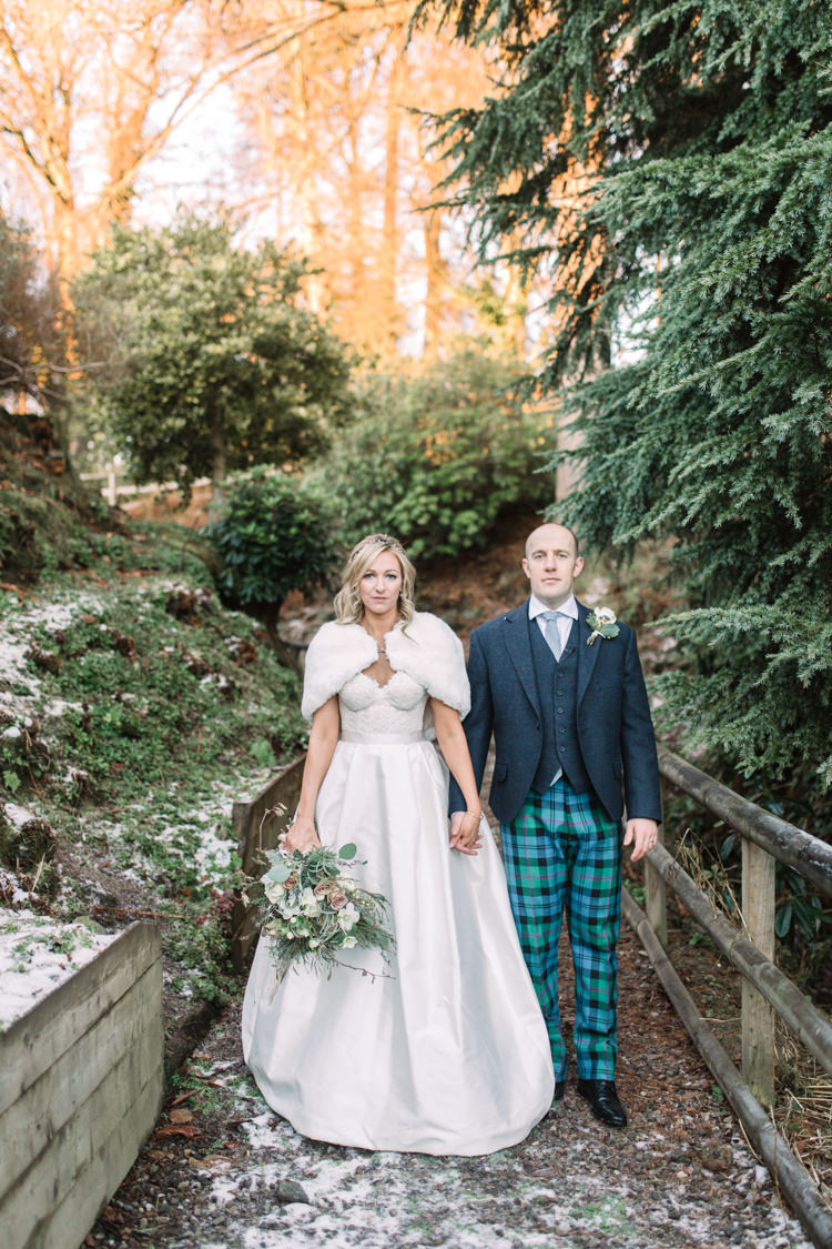 Bride Bridal Sweetheart Neckline Hair Piece Lace A Line Faux Fur Stole Cape Tartan Trousers Groom Three Piece Waistcoat Tweed Jacket Enchanted Magical Snowy Wedding https://www.thegibsonsphotography.co.uk/