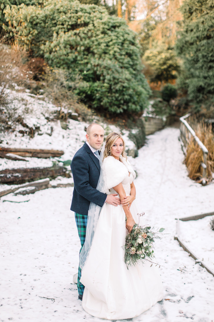 Bride Bridal Sweetheart Neckline Hair Piece Lace A Line Faux Fur Stole Cape Tartan Trousers Groom Three Piece Waistcoat Tweed Jacket Enchanted Magical Snowy Wedding https://www.thegibsonsphotography.co.uk/