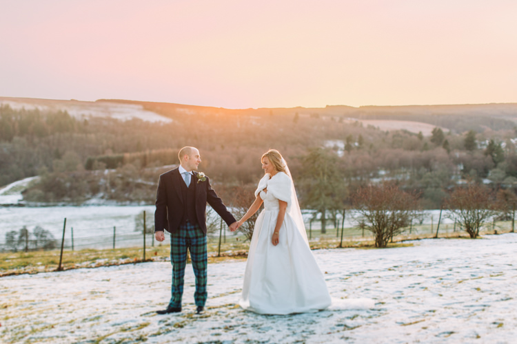 Bride Bridal Sweetheart Neckline Hair Piece Lace A Line Faux Fur Stole Cape Tartan Trousers Groom Three Piece Waistcoat Tweed Jacket Enchanted Magical Snowy Wedding https://www.thegibsonsphotography.co.uk/