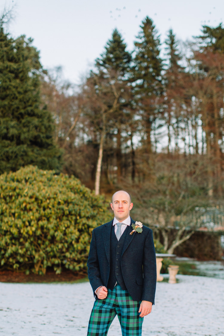 Tartan Trousers Groom Tweed Three Piece Waistcoat Enchanted Magical Snowy Wedding https://www.thegibsonsphotography.co.uk/