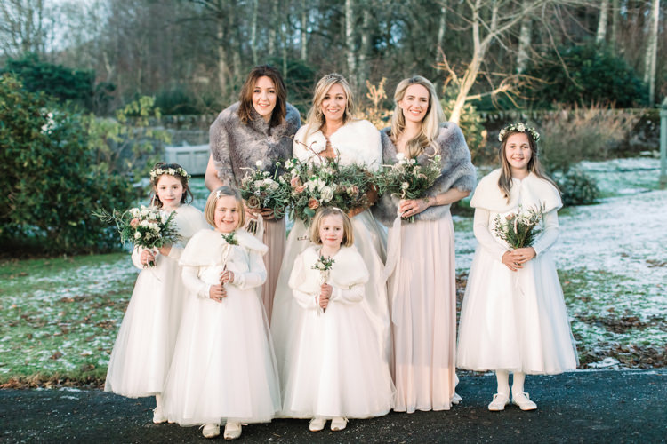 Bride Bridal Sweetheart Neckline Hair Piece Lace A Line Faux Fur Stole Cape Bridesmaids Dessy Pink Blush Dress Floor Length Fur Stole Cape Flower Girls White Floral Wand Enchanted Magical Snowy Wedding https://www.thegibsonsphotography.co.uk/