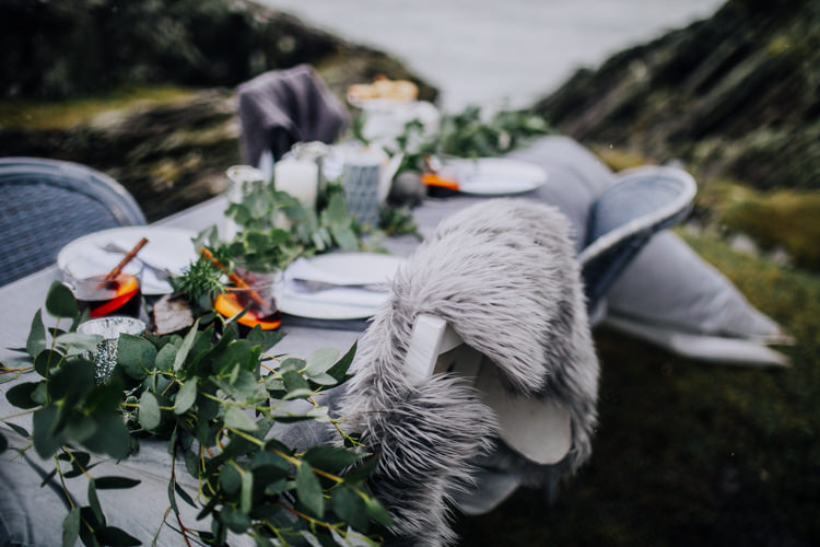 Tablescape Decor Grey White Greeenery Candles Foliage Fabric Ocean Clifftop Elopement Wedding Ideas North Wales https://www.claracooperphotography.com/