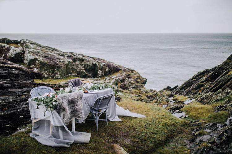 Tablescape Decor Grey White Greeenery Candles Foliage Fabric Ocean Clifftop Elopement Wedding Ideas North Wales https://www.claracooperphotography.com/