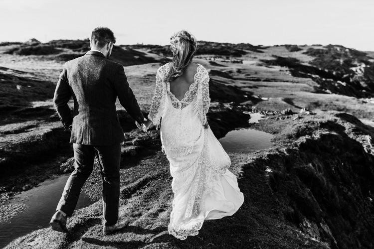 Dress Lace Sleeves Bride Bridal Hair Long Fringe Tassel Ocean Clifftop Elopement Wedding Ideas North Wales https://www.claracooperphotography.com/