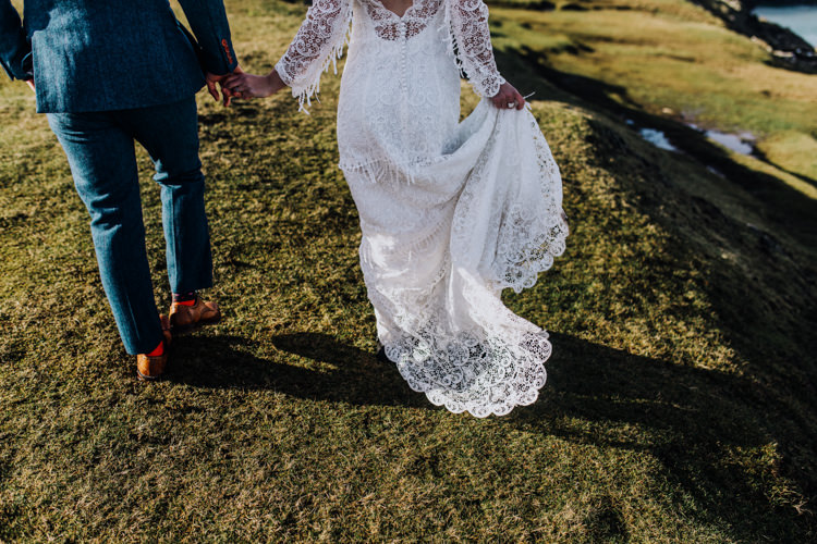 Dress Lace Sleeves Bride Bridal Hair Long Fringe Tassel Ocean Clifftop Elopement Wedding Ideas North Wales https://www.claracooperphotography.com/