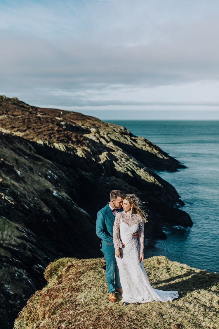 Dress Lace Sleeves Bride Bridal Hair Long Fringe Tassel Ocean Clifftop Elopement Wedding Ideas North Wales https://www.claracooperphotography.com/