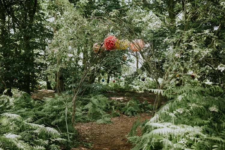 Field Outdoor Tipi Hippie Bride Groom Paper Pompoms Flower Arch | Happy Outdoor Forest Mustard Yellow Wedding http://suzi-photography.com/