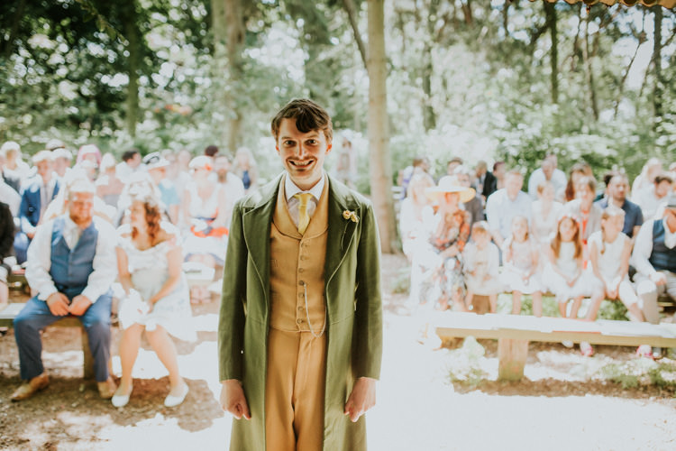 Field Outdoor Garden Woodland Hippie Summer Tipi Ceremony Mustard Green Suit Groom | Happy Outdoor Forest Mustard Yellow Wedding http://suzi-photography.com/