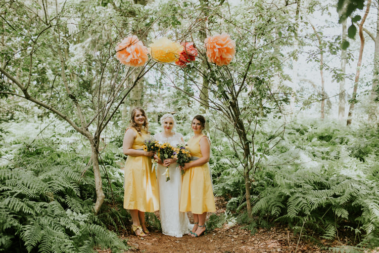 Field Outdoor Garden Tipi Hippie Bride Bridesmaids Paper Pompoms Flower Arch | Happy Outdoor Forest Mustard Yellow Wedding http://suzi-photography.com/