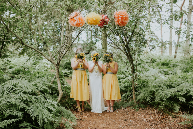 Field Outdoor Garden Tipi Hippie Bride Bridesmaids Paper Pompoms Flower Arch Sunflower Bouquets | Happy Outdoor Forest Mustard Yellow Wedding http://suzi-photography.com/