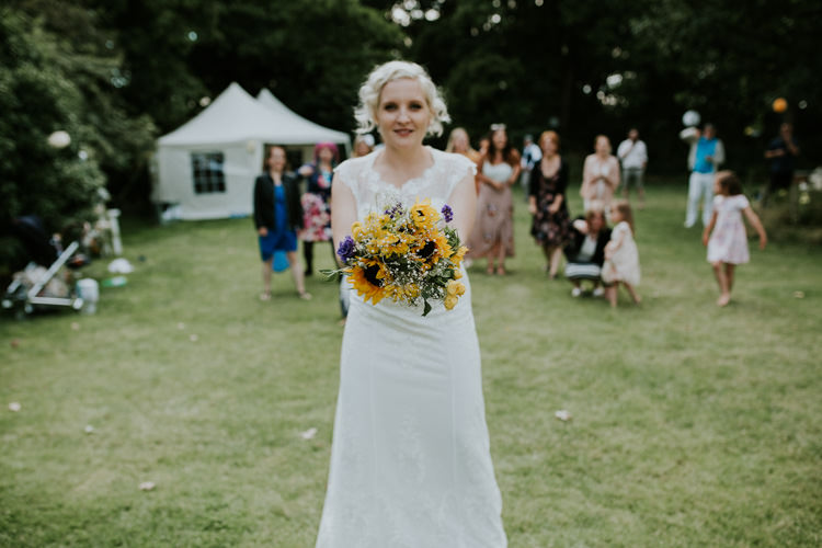 Field Garden Woodland Meadow Hippie Summer Bride Sunflower Bouquet Toss Hush Venue | Happy Outdoor Forest Mustard Yellow Wedding http://suzi-photography.com/