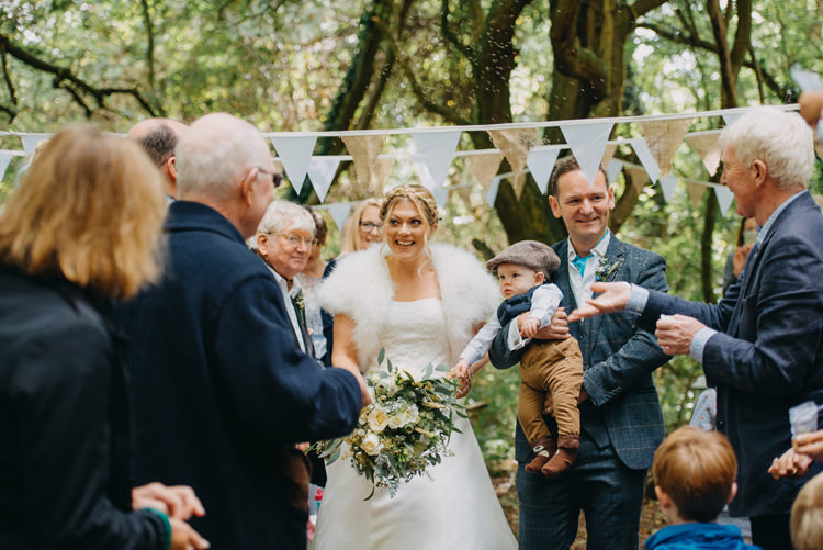 Bride Bridal Gown Dress Bolero Strapless Halo Braid Hairstyle Blue Checked Groom Cravat Three Piece Waistcoat Bouquet Bunting Magical Woodland Family Wedding http://photographybyclare.co.uk/