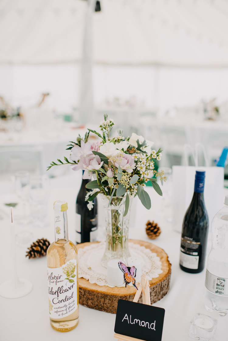Table Centre Wood Slice Tree Flowers Floral Vase Magical Woodland Family Wedding http://photographybyclare.co.uk/