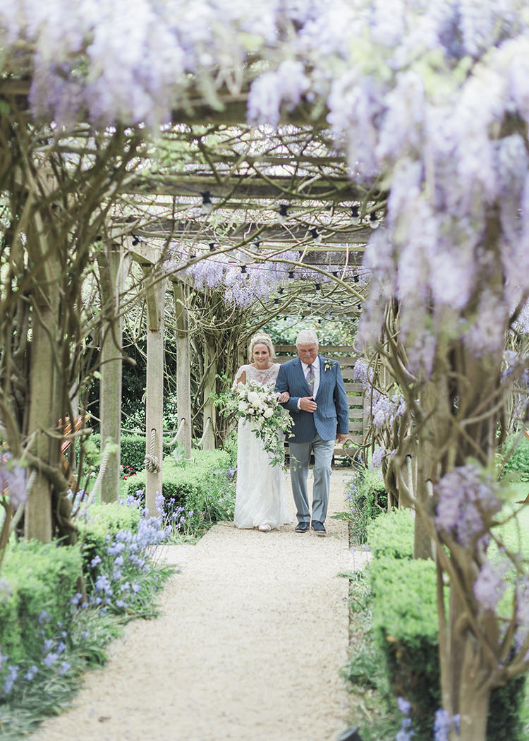 Wisteria Aisle Ceremony Darling Fresh Bohemian Barn Wedding https://razia.photography/